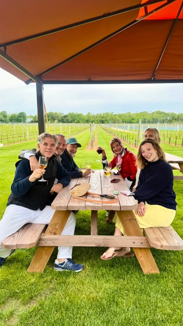Guests under umbrellas on a rainy holiday weekend