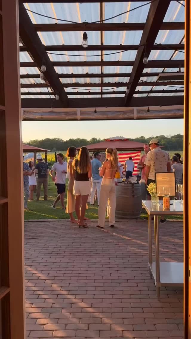 Sunset party seen through the tasting room doors